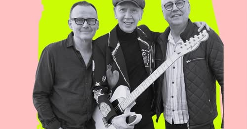 Three men stand together; the man in the center holds an electric guitar, and all face the camera. The image is black and white with a bright green background and pink strips at the sides.